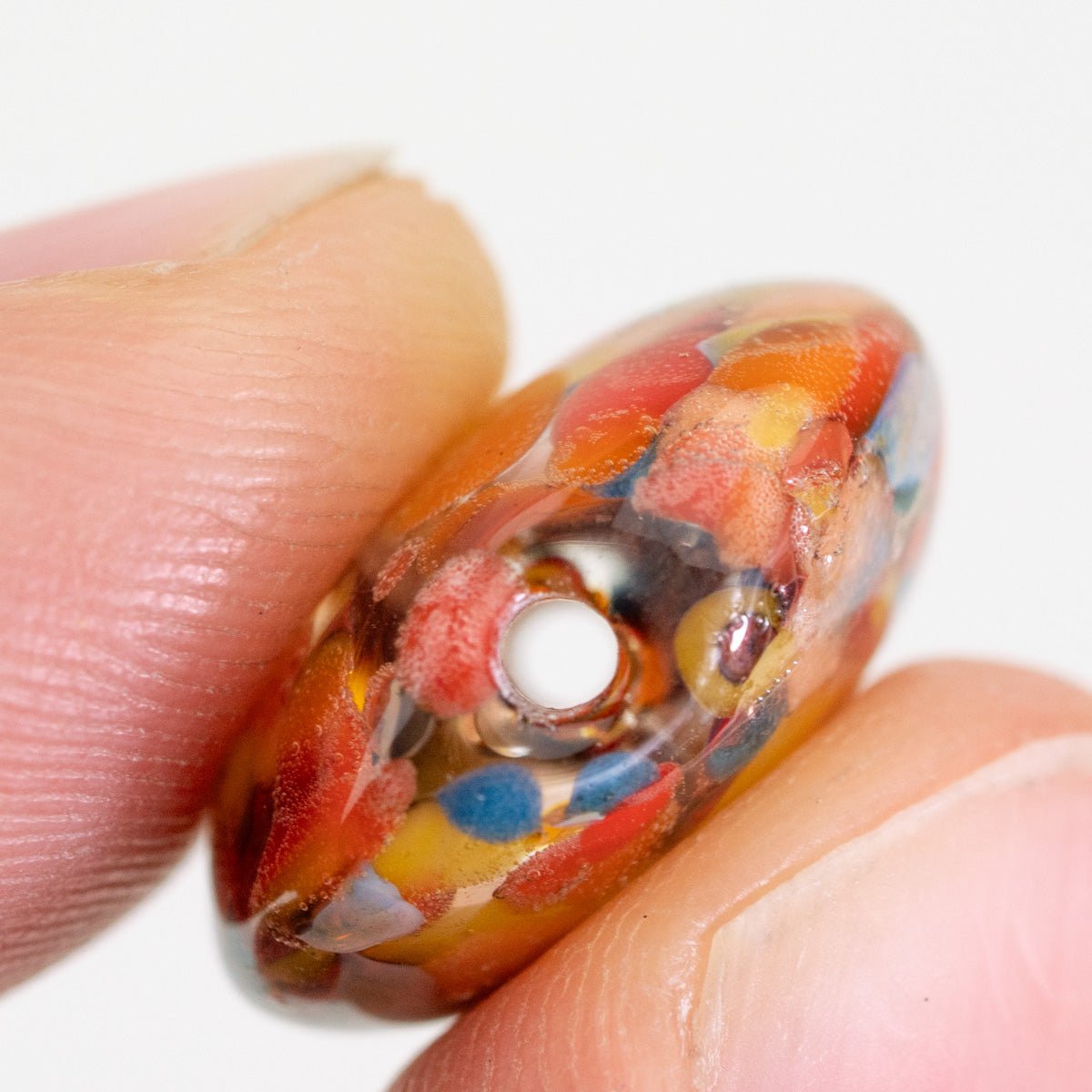 Close up of Bird of Paradise small coin bead showing glass detail