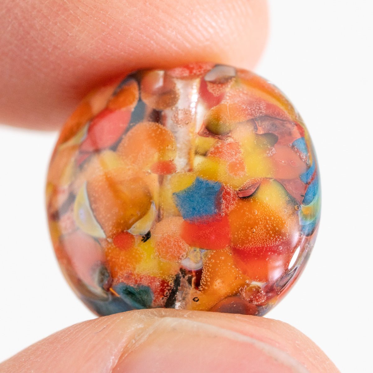 Bird of Paradise small coin glass bead with multicolor layered pattern