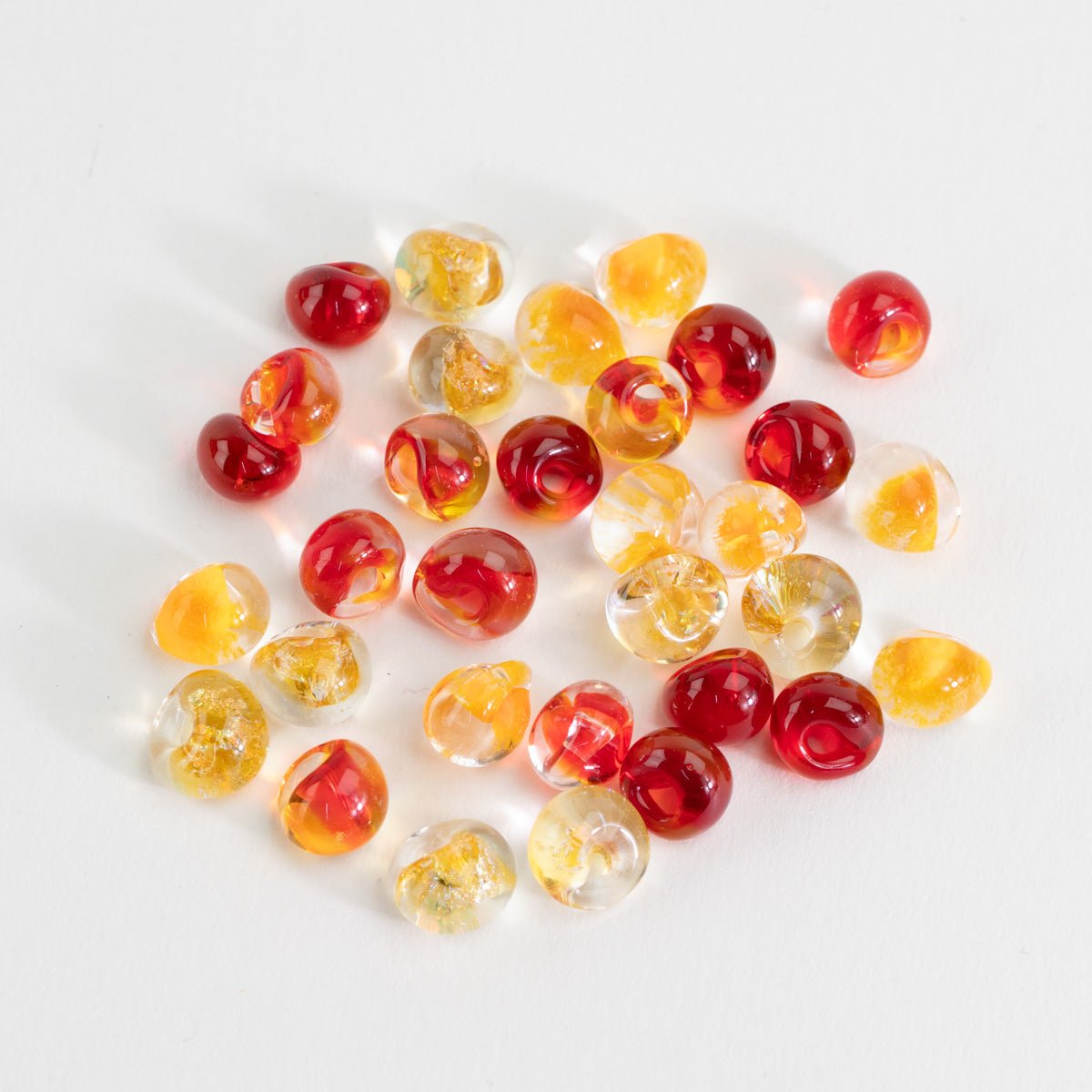 Flicker and Flame palette teardrop glass bead tube with red, amber, and yellow handmade beads