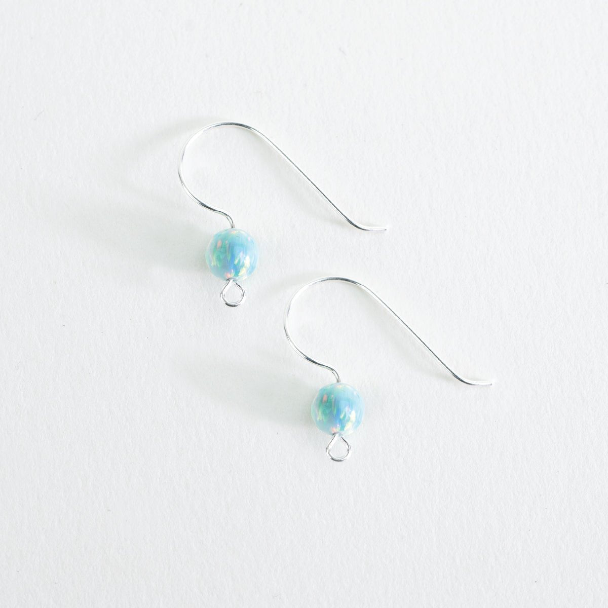 Finished Glacier Tide Opal Ear Wire earrings with aqua opalescent glass beads on silver ear wires
