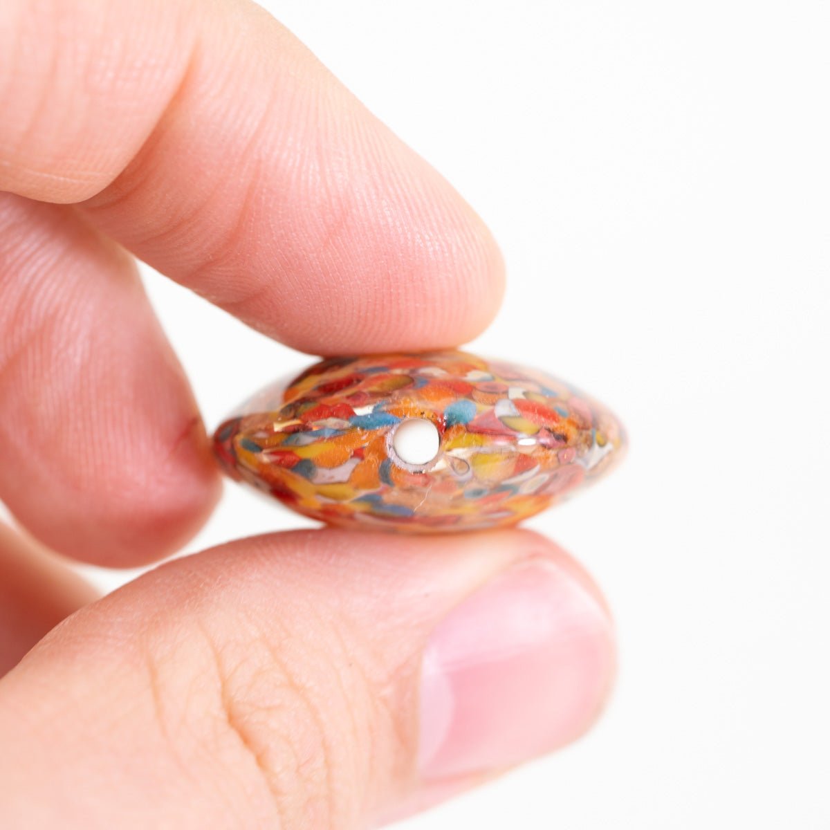 Handmade Bird of Paradise coin bead by Unicorne Beads with vibrant tropical tones