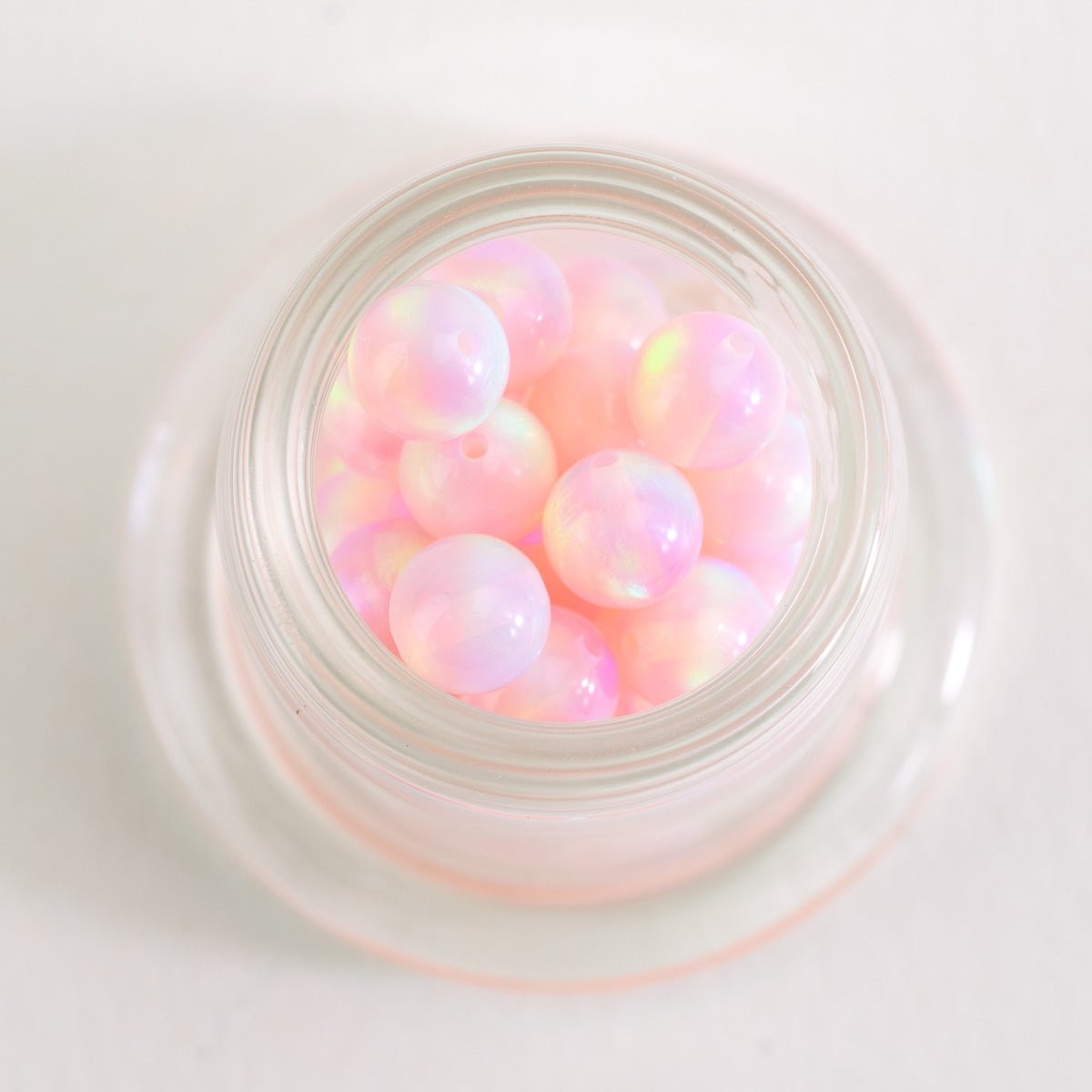 Close up of Pink Stardust opal beads with soft iridescent tones