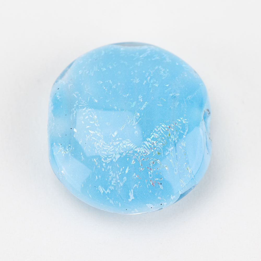 One large glass jewelry bead light blue in color with a dichroic finish. Glass bead has two holes on either side to be used for jewelry projects. 