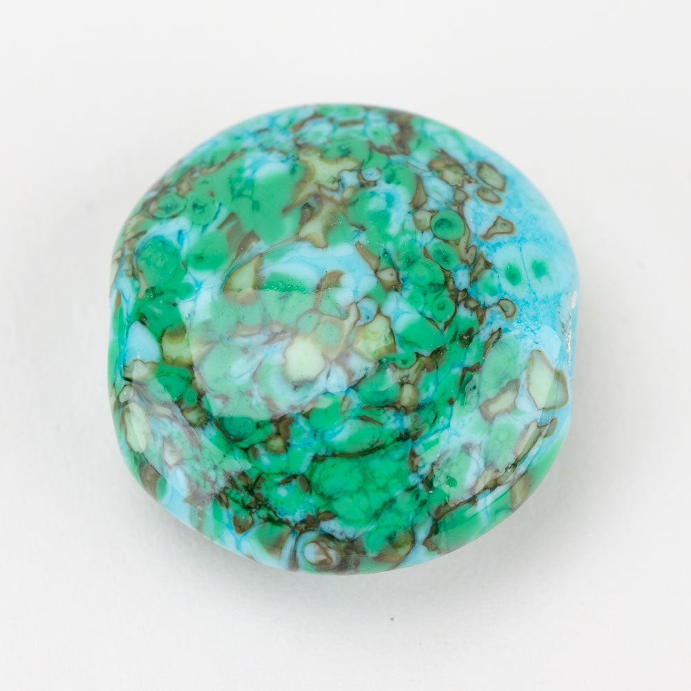 Large glass bead with a mix of green, brown, blue, and tan colors. Glass bead has a hollow center to be used for jewelry crafting. 