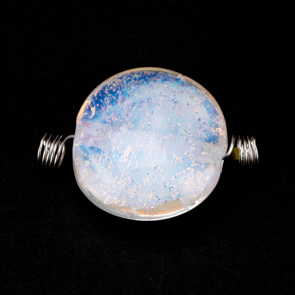 One large glass bead, clear-blue in color with a dichroic finish. a wire runs through the center of the bead, spiraled on the ends. 