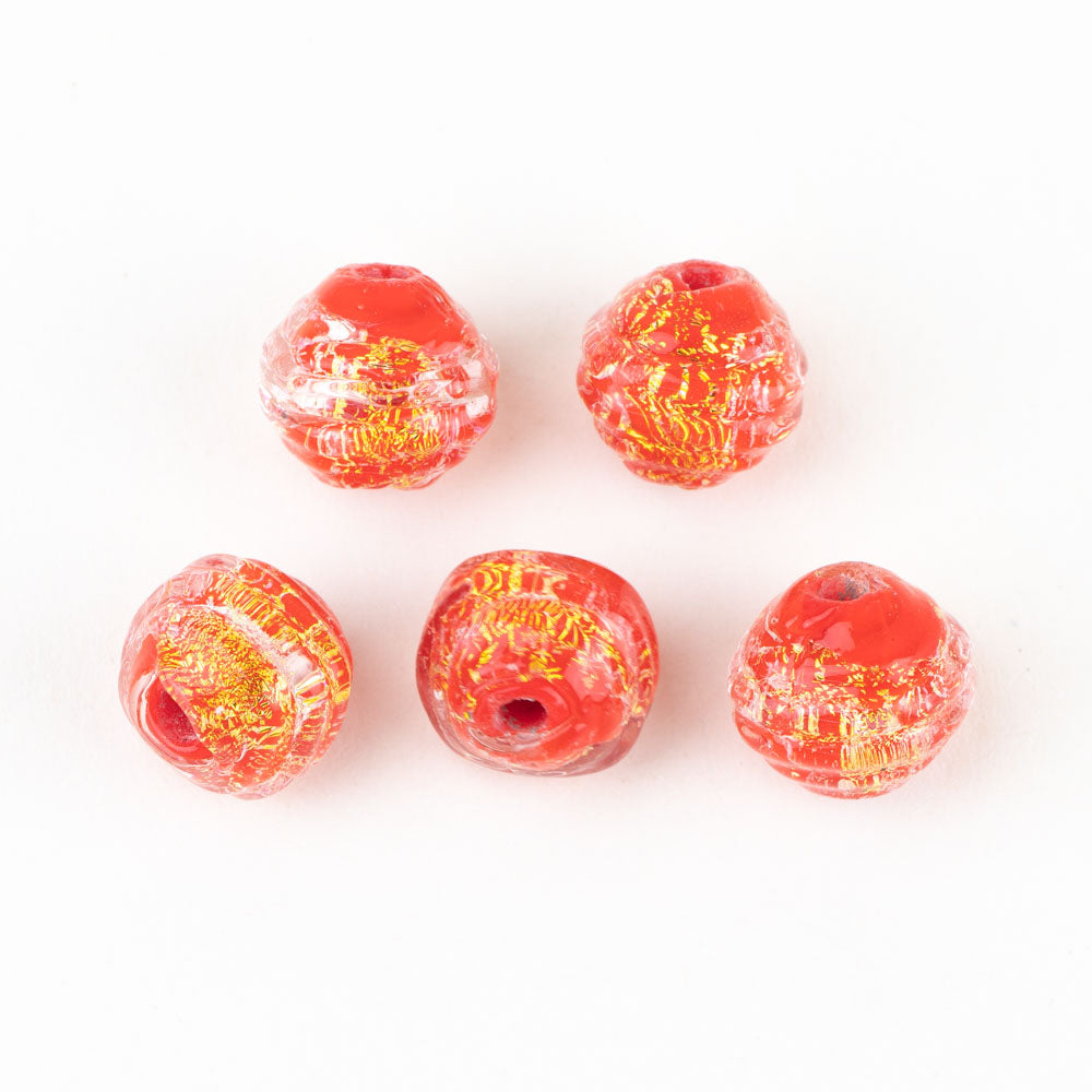 Five coconut shaped glass jewelry beads, red in  color with yellow dichroic features. Each glass bead had a hollow center to be used for jewelry making projects.