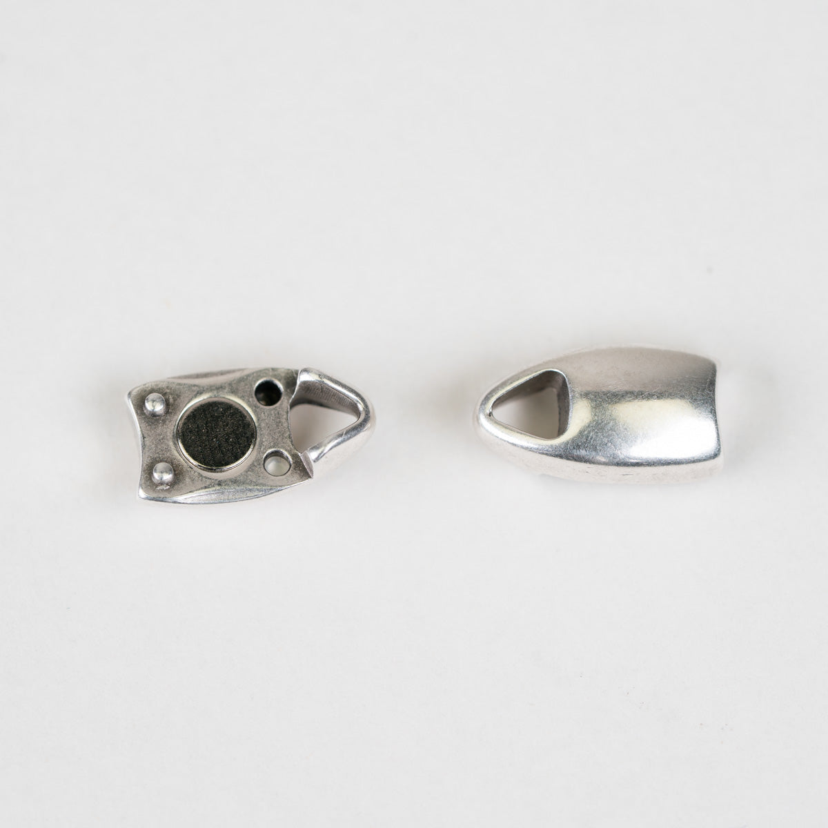Close-up of a silver bracelet on a white background