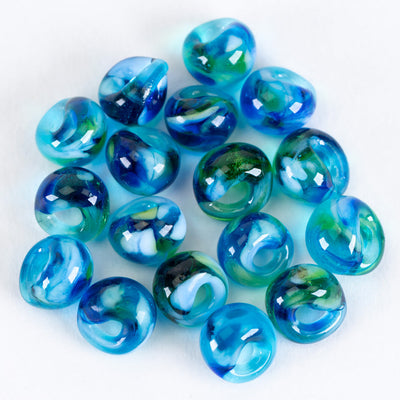 A group of teadrop mini glass beads handblown by Unicorne Beads