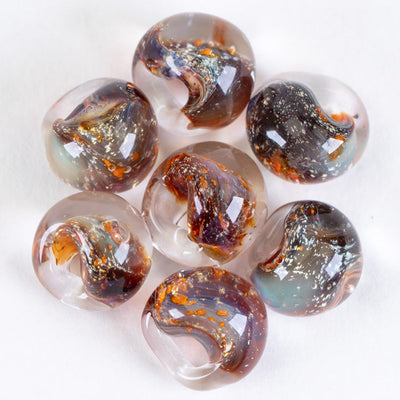 A group of regular sized teardrop glass beads handmade by Unicorne Beads