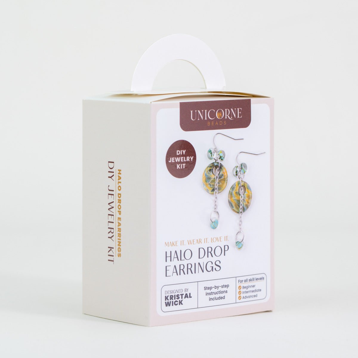 Angled view of Aurora Sands Halo Drop Earrings DIY kit with finished earring design displayed