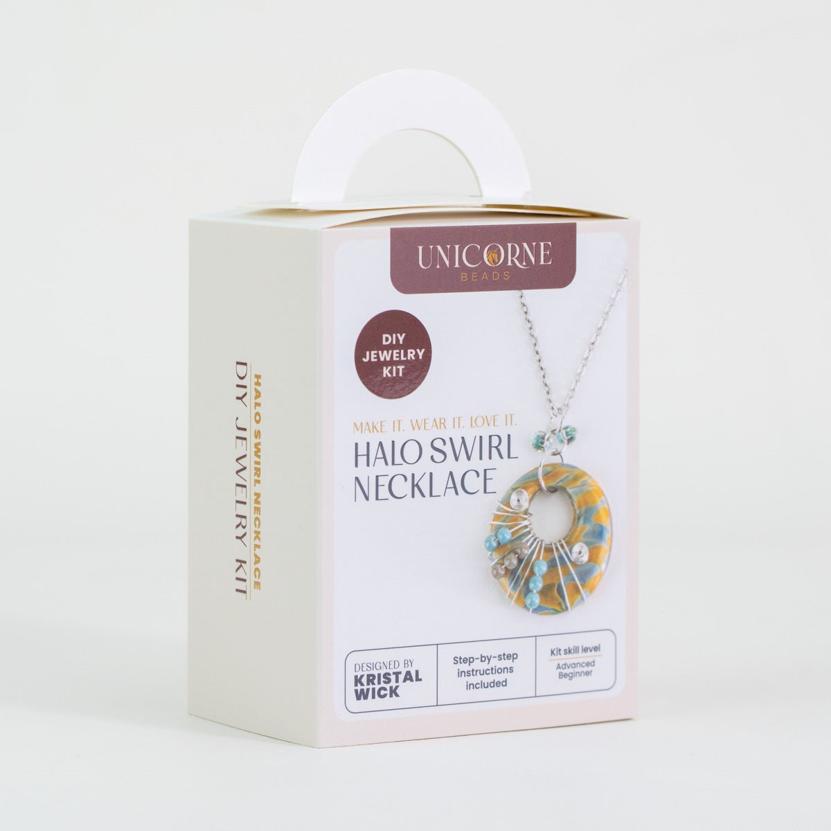 Angled view of Aurora Sands halo swirl necklace DIY kit box