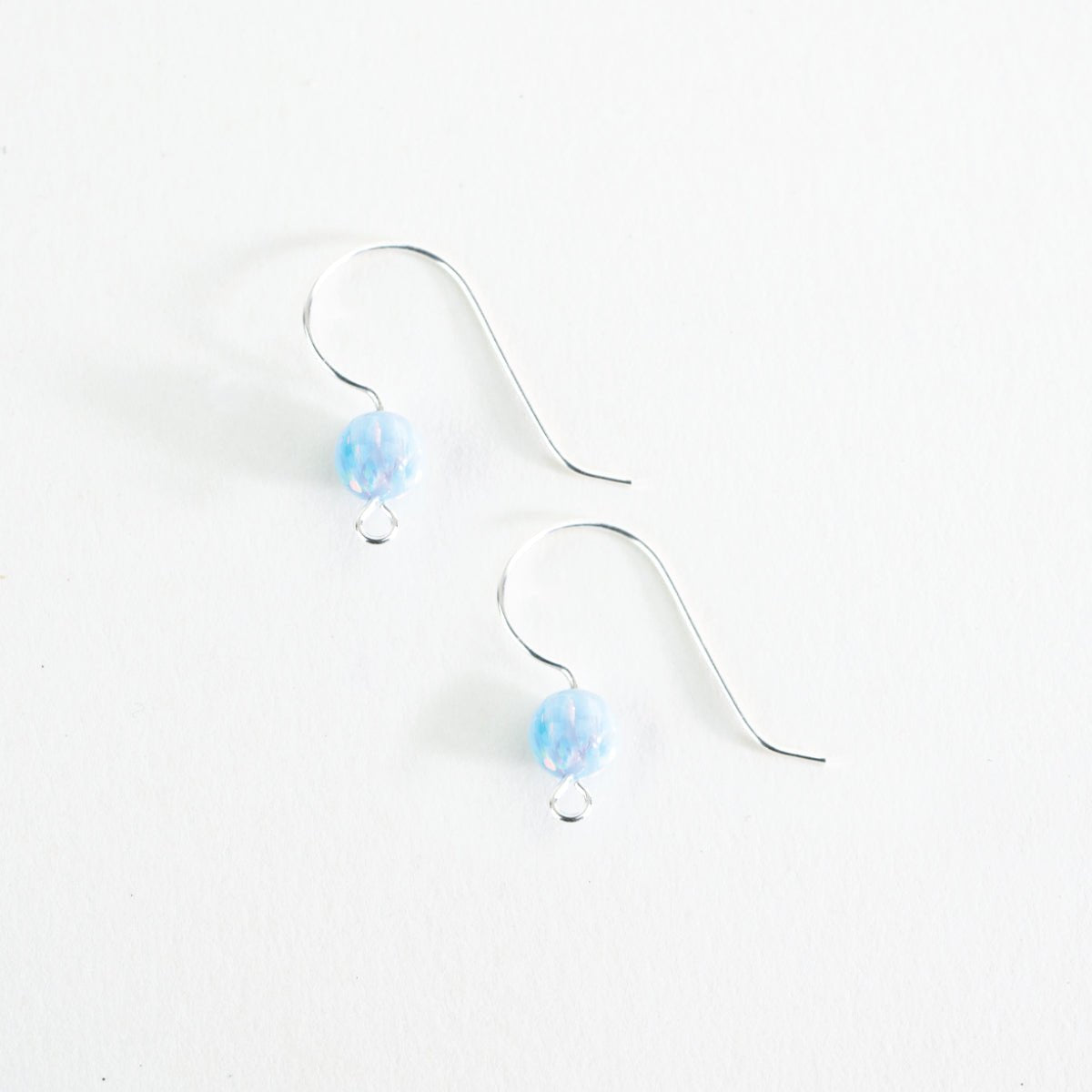 Finished Blue Whisper opal ear wire earrings with soft blue glass beads
