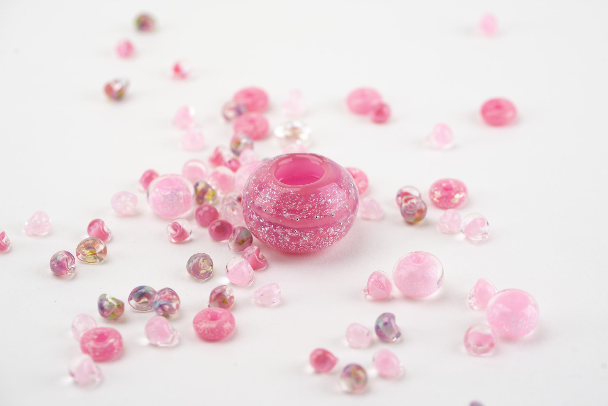 Shimmering pink glass beads arranged in honor of breast cancer awareness month