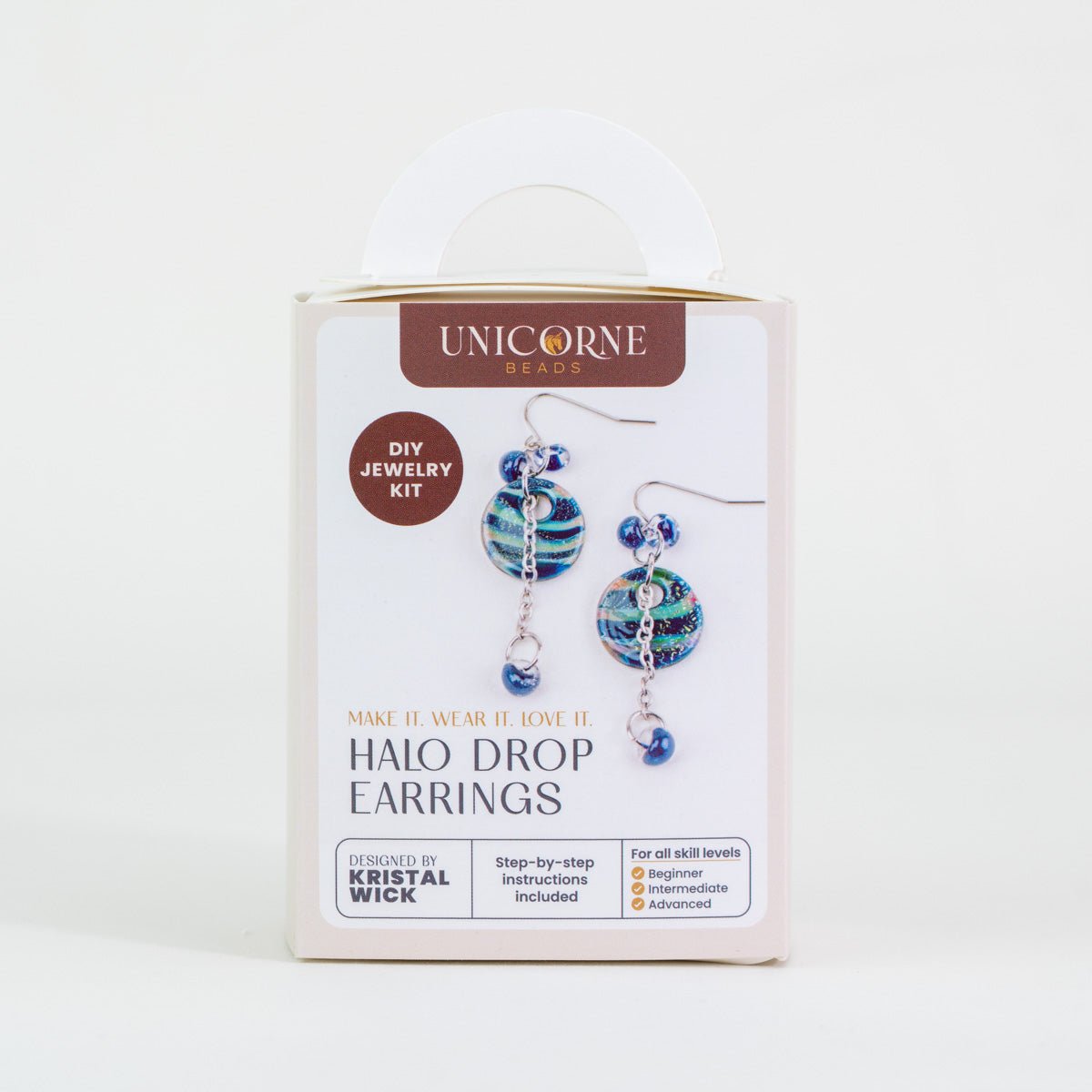 Close-up of deep lagoon glass halo beads with gold fleck detailing