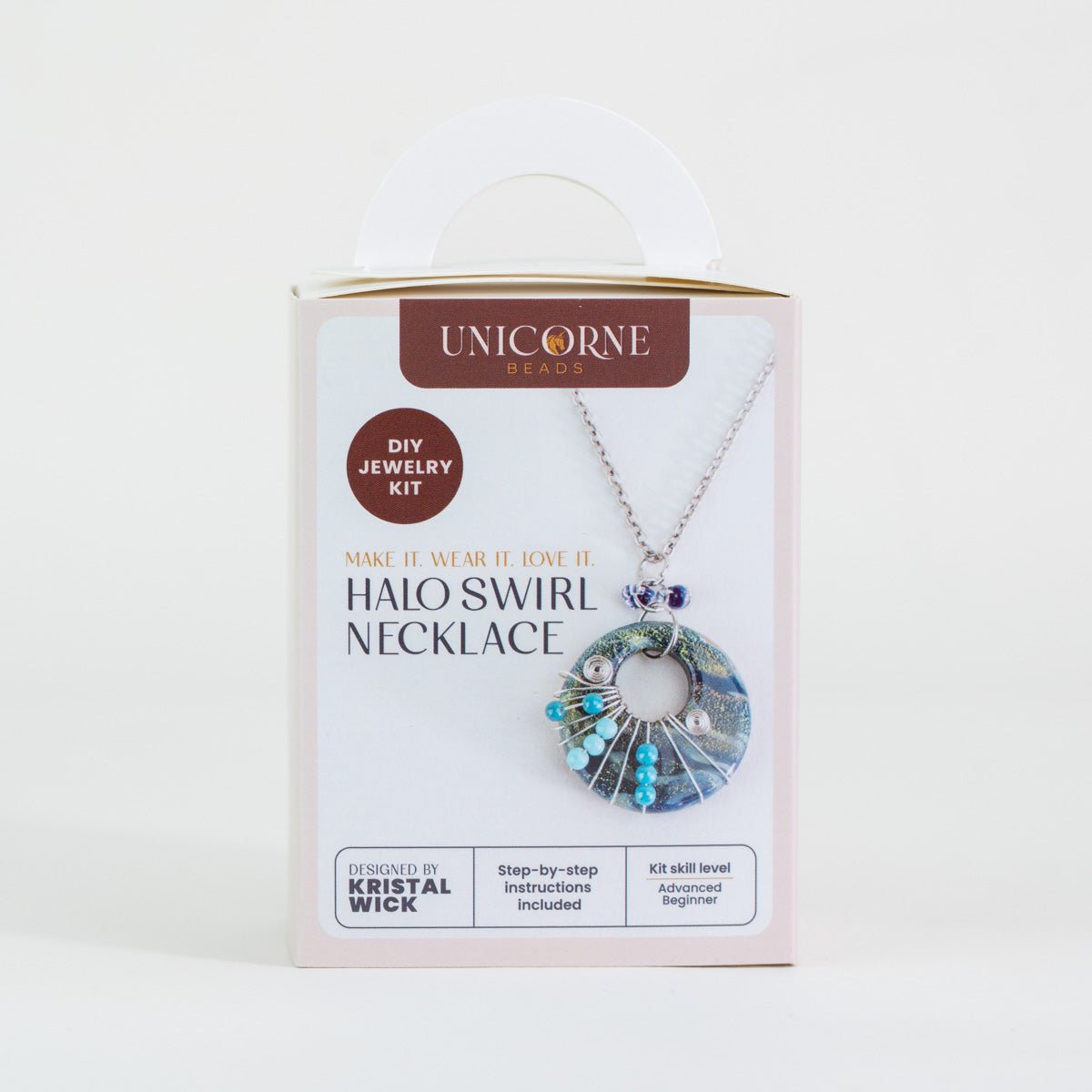 Close up of deep lagoon halo swirl necklace wire and bead details