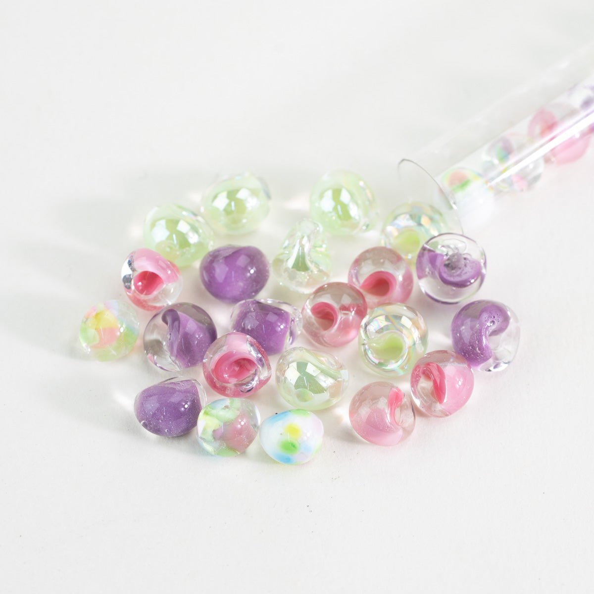 handmade lampwork teardrop beads with soft pastel colors and transparent glass