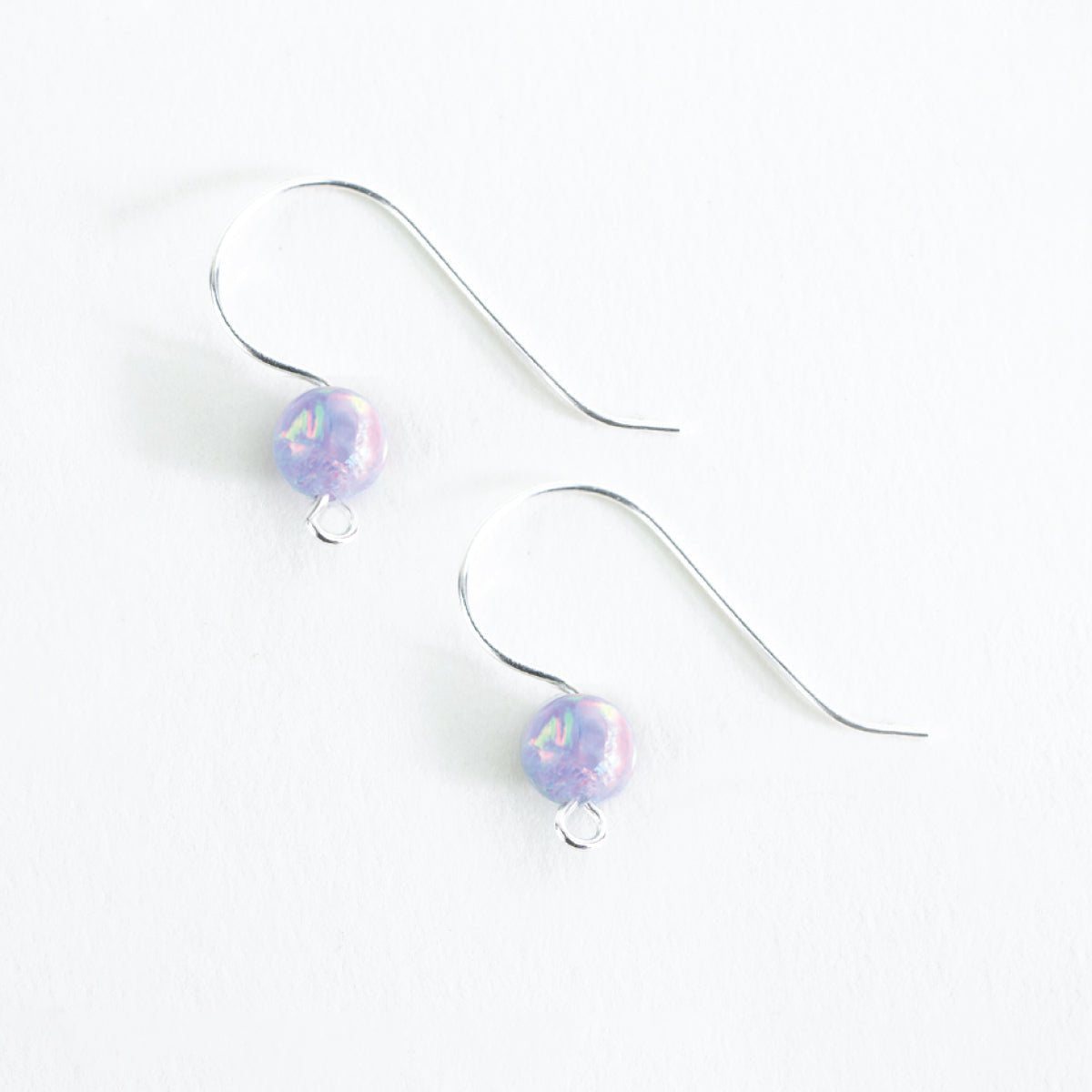 Finished lavender aurora opal ear wire earrings made with Unicorne Beads DIY kit