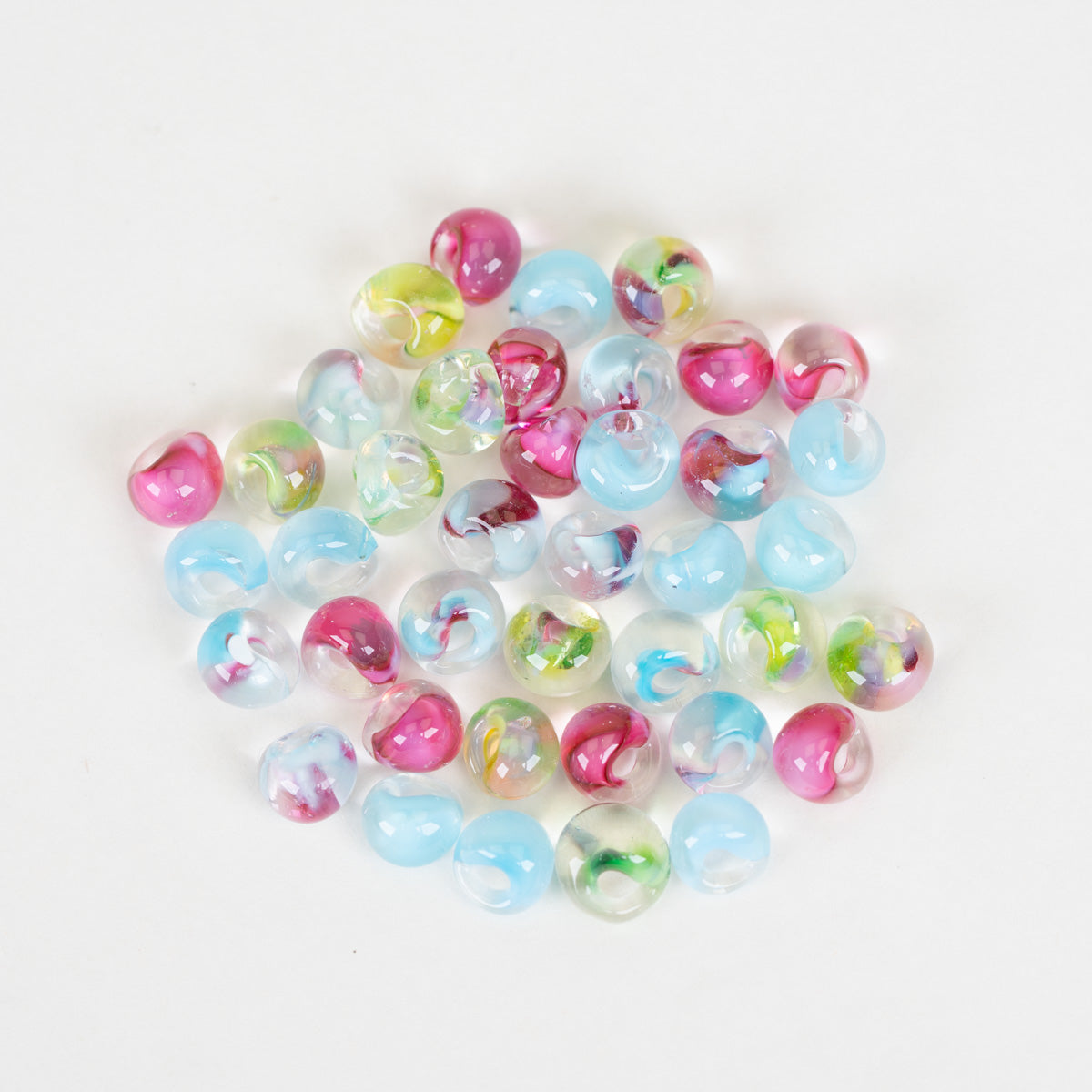 Mini Unicorne Beads teardrop collection on a plain white background