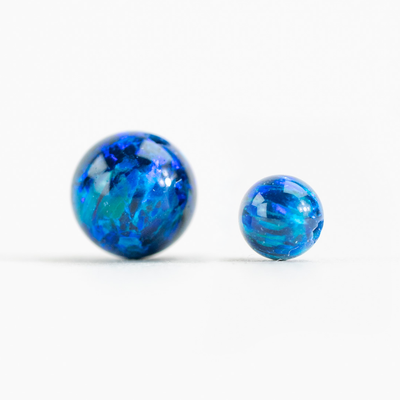 Two opal bead side by side for size reference 4mm & 6mm