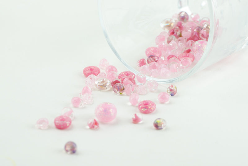 Shimmering pink glass beads arranged in honor of breast cancer awareness month
