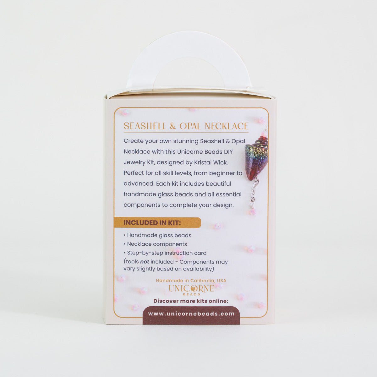 Close up detail of ruby rainbow glass seashell necklace