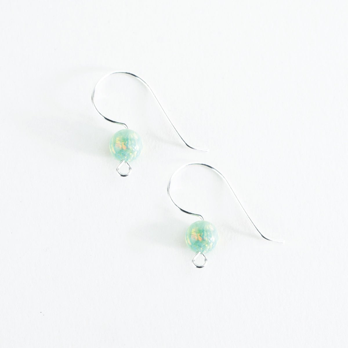 Finished Seafoam Dream opal ear wire earrings with soft green glass beads