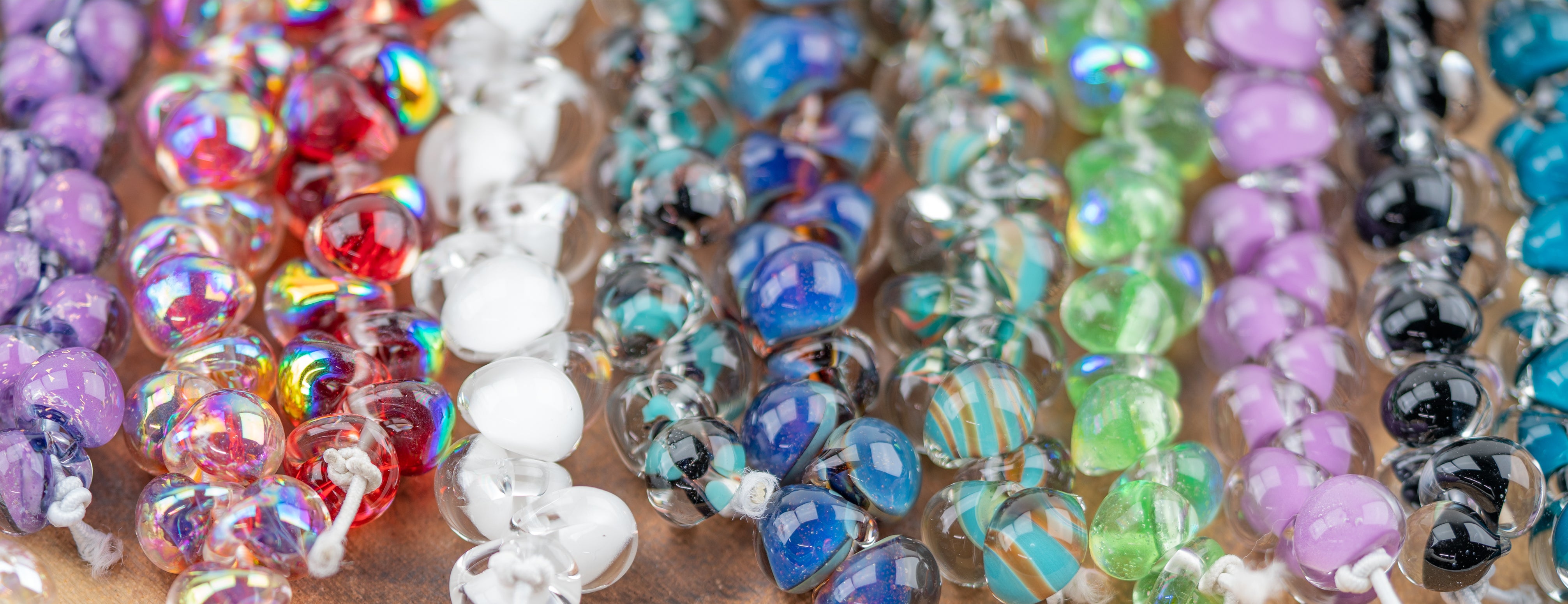 Arrangement of multi colored glass teardrop beads for jewelry projects