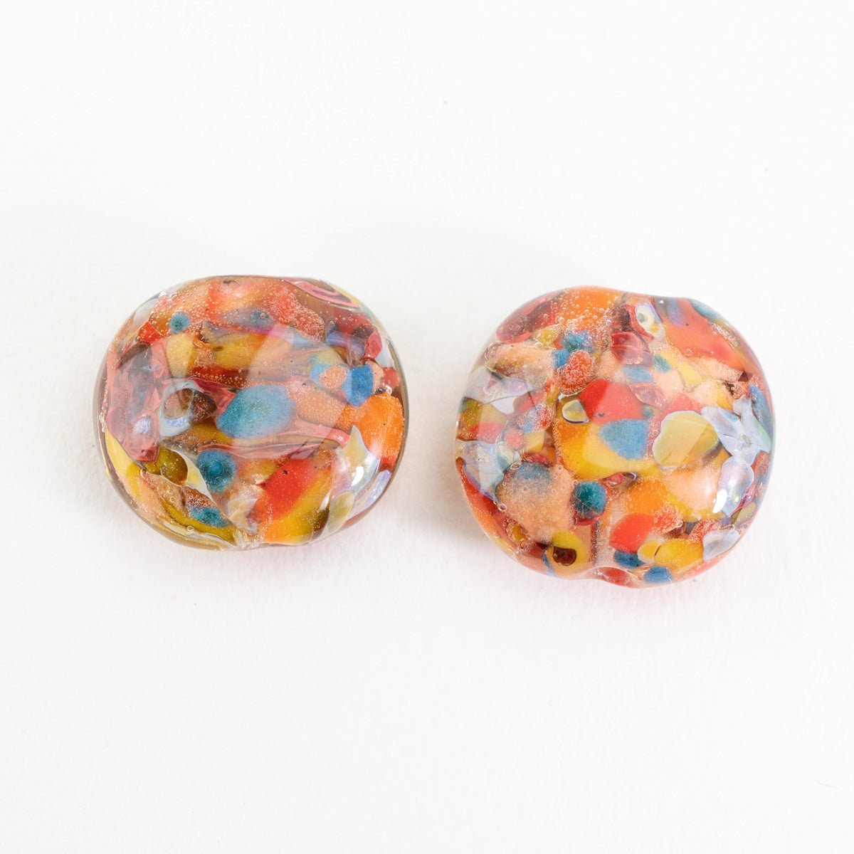 Small Bird of Paradise coin bead made from handmade lampwork glass