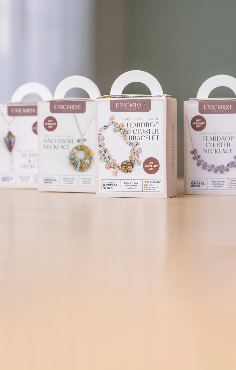 Unicorne DIY Jewelry Kits displayed in gift-ready boxes for making necklaces and bracelets at home.