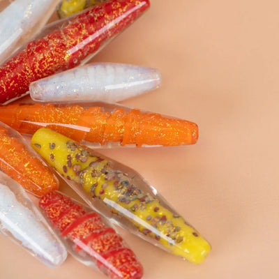 Bicone glass beads displayed to show different sizes and colors by Unicorne Beads