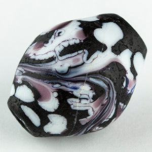 One large Unicorne Barrel Bead. Bead has a black and white color swirl with a touch of purple mixed throughout. The glass bead has a hole lengthwise that allows for jewelry makers to string onto a necklace. 